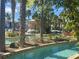 Community lazy river surrounded by palm trees and tropical foliage at 3197 Sea World Ct, Kissimmee, FL 34746
