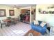 Combined living area with a kitchen, dining table, and comfortable seating, all with natural light at 3197 Sea World Ct, Kissimmee, FL 34746