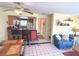 Open-concept living space with kitchen, living, dining, and stairwell in a single space at 3197 Sea World Ct, Kissimmee, FL 34746
