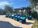 Community lounge area with wicker chairs and blue cushions at 3197 Sea World Ct, Kissimmee, FL 34746
