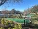 Landscaped miniature golf course with paved path and putting greens at 3197 Sea World Ct, Kissimmee, FL 34746