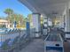 Community pool area featuring lounge chairs, foosball table and palm trees at 3197 Sea World Ct, Kissimmee, FL 34746