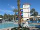 Community pool and waterslide offering shaded seating and plenty of chairs for residents at 3197 Sea World Ct, Kissimmee, FL 34746