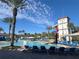 Community pool with large slide and chairs at 3197 Sea World Ct, Kissimmee, FL 34746