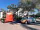 Unique and inviting Fantasy World Resort entrance with oversized chair and decorative car at 3197 Sea World Ct, Kissimmee, FL 34746