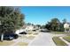 Aerial view of a quiet residential street with houses and lush green trees at 3260 Sorrel Ct, Deltona, FL 32725