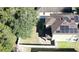 House with solar panels on the roof and a fenced backyard at 3260 Sorrel Ct, Deltona, FL 32725