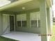 Covered patio with multiple windows and sliding glass doors at 3260 Sorrel Ct, Deltona, FL 32725