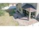 Brick patio with fire pit and covered seating area at 3260 Sorrel Ct, Deltona, FL 32725