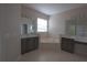 Double vanity bathroom with corner tub and separate shower at 3260 Sorrel Ct, Deltona, FL 32725