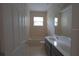 Clean bathroom with double vanity and bathtub at 3260 Sorrel Ct, Deltona, FL 32725