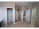 Bathroom with shower, toilet and access to a bedroom and closet at 3260 Sorrel Ct, Deltona, FL 32725