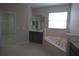 Bathroom boasts a corner tub and double vanity at 3260 Sorrel Ct, Deltona, FL 32725