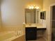 Bathroom features a large vanity and corner soaking tub at 3260 Sorrel Ct, Deltona, FL 32725