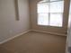 Simple bedroom with neutral walls, carpet, and a window with blinds at 3260 Sorrel Ct, Deltona, FL 32725