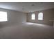 Large bedroom with carpet flooring and multiple windows at 3260 Sorrel Ct, Deltona, FL 32725
