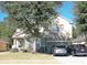 Two-story house with a green facade, stone accents, and a two-car garage at 3260 Sorrel Ct, Deltona, FL 32725