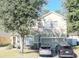 Two-story house with a green facade, stone accents, and a two-car garage at 3260 Sorrel Ct, Deltona, FL 32725