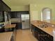 Spacious kitchen with stainless steel appliances and granite countertops at 3260 Sorrel Ct, Deltona, FL 32725