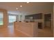 Kitchen features a breakfast bar and dark brown cabinetry at 3260 Sorrel Ct, Deltona, FL 32725