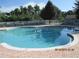 Community pool with brick deck and fenced area at 3260 Sorrel Ct, Deltona, FL 32725