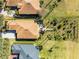 High-angle view of home and meticulously landscaped yard at 4 Arika At Lionspaw, Daytona Beach, FL 32124
