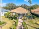 Aerial view of house and lush, landscaped backyard at 4 Arika At Lionspaw, Daytona Beach, FL 32124