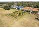 Aerial view of a house with a manicured lawn and unique garden at 4 Arika At Lionspaw, Daytona Beach, FL 32124