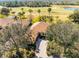 Aerial view of house, landscaping, and golf course at 4 Arika At Lionspaw, Daytona Beach, FL 32124