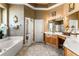 Elegant bathroom with double vanity, soaking tub, and separate shower at 4 Arika At Lionspaw, Daytona Beach, FL 32124