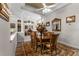 Bright dining room with wood table and access to other rooms at 4 Arika At Lionspaw, Daytona Beach, FL 32124