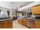 Open kitchen features granite countertops and wood cabinets at 4 Arika At Lionspaw, Daytona Beach, FL 32124