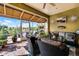 Spacious lanai with seating area, screened enclosure, and golf course view at 4 Arika At Lionspaw, Daytona Beach, FL 32124