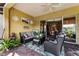 Outdoor patio with seating area and view into the home's interior at 4 Arika At Lionspaw, Daytona Beach, FL 32124