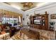 Open living room with hardwood floors and access to the lanai at 4 Arika At Lionspaw, Daytona Beach, FL 32124