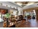 Spacious living room with hardwood floors and access to the lanai at 4 Arika At Lionspaw, Daytona Beach, FL 32124