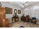 Home office with wood desk, tile floors and plantation shutters at 4 Arika At Lionspaw, Daytona Beach, FL 32124
