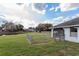 Fenced-in backyard with a view of a tranquil pond and lush greenery at 4001 Misty Morning Pl, Casselberry, FL 32707