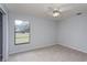 Bedroom with carpet flooring, a ceiling fan, and ample natural light at 4001 Misty Morning Pl, Casselberry, FL 32707
