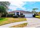 Charming single-story home with well-maintained landscaping and a two-car garage at 4001 Misty Morning Pl, Casselberry, FL 32707