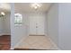 Inviting foyer with tile flooring, neutral paint, and double doors for ample closet space upon entry at 4001 Misty Morning Pl, Casselberry, FL 32707