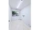 A utility room with tile floors, a window, and plumbing for laundry hookups at 4001 Misty Morning Pl, Casselberry, FL 32707