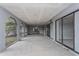 Spacious covered patio with screen windows and an entrance to the backyard at 4001 Misty Morning Pl, Casselberry, FL 32707