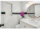 Modern bathroom, marble vanity, and decorative mirror at 4333 Arch St, Orlando, FL 32808