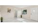 Bright entryway with white walls, marble floors, and a view to the street at 4333 Arch St, Orlando, FL 32808