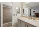 Bathroom featuring a vanity, large mirror, and shower stall at 600 Cranes Way # 206, Altamonte Springs, FL 32701