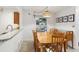 Dining area with wood table and chairs, kitchen passthrough at 600 Cranes Way # 206, Altamonte Springs, FL 32701