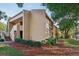 Condo building with stairs and manicured landscaping at 600 Cranes Way # 206, Altamonte Springs, FL 32701