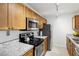 Modern kitchen with stainless steel appliances and granite countertops at 600 Cranes Way # 206, Altamonte Springs, FL 32701