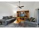 Living room features a sofa, coffee table, and entertainment center at 600 Cranes Way # 206, Altamonte Springs, FL 32701